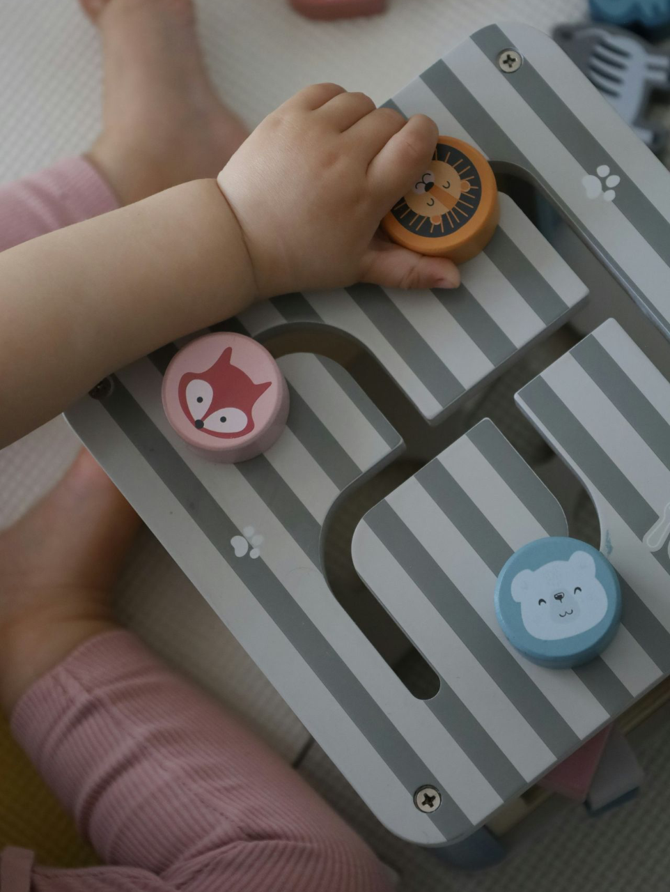 a child playing with a toy on a table